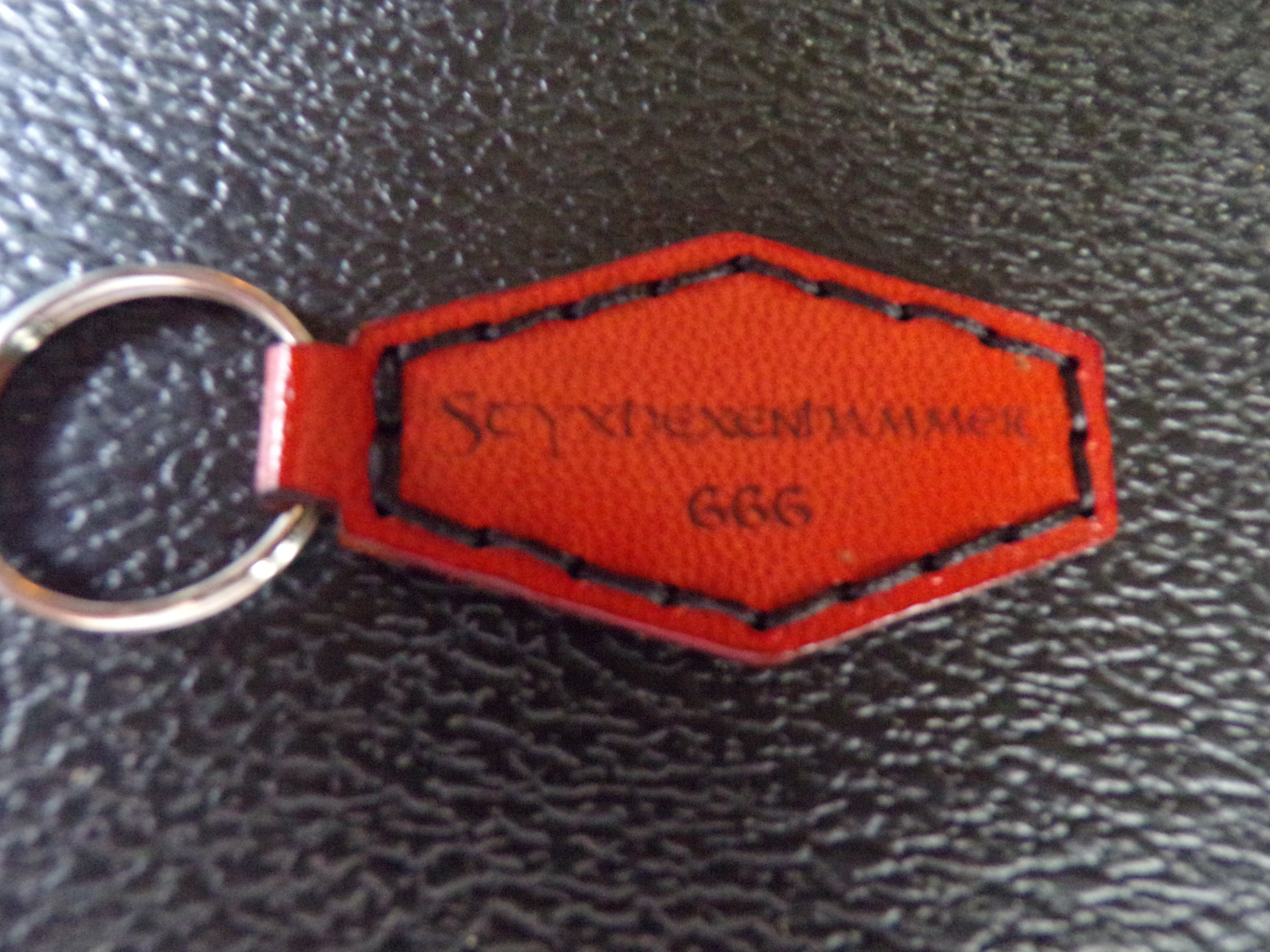 Styx Two-Sided Leather Keychains
