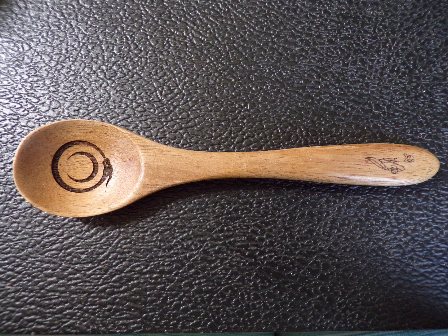 Styx Acacia wood spoon with a Snowdrop and Ouroboros