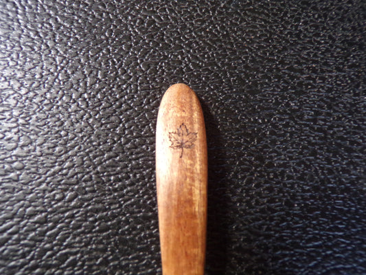 Styx Acacia wood spoon with a Maple Leaf and Ouroboros